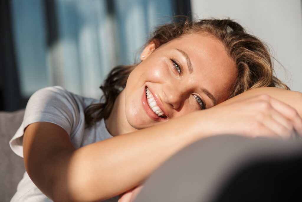 Woman with beautiful smile looking at camera Retainer program
