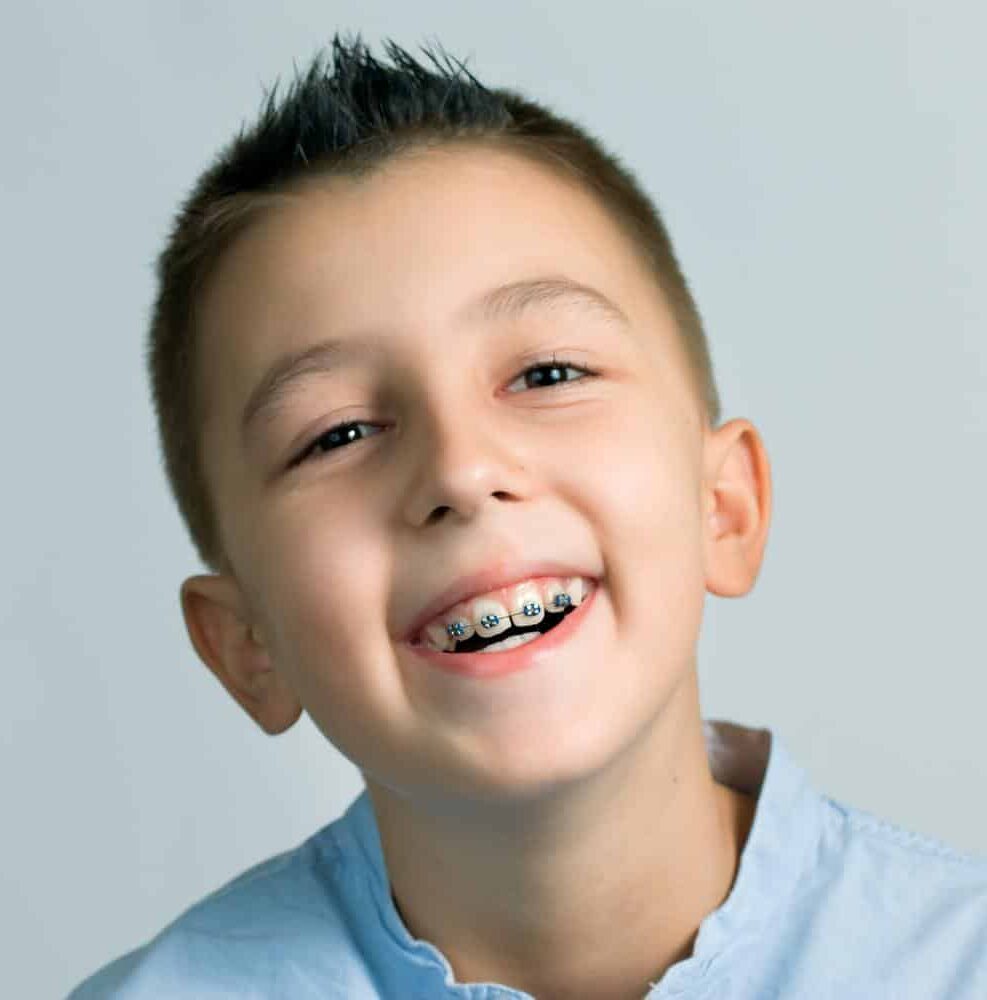 Preteen-boy-braces-orthodontic-care Preteen boy with braces smiling