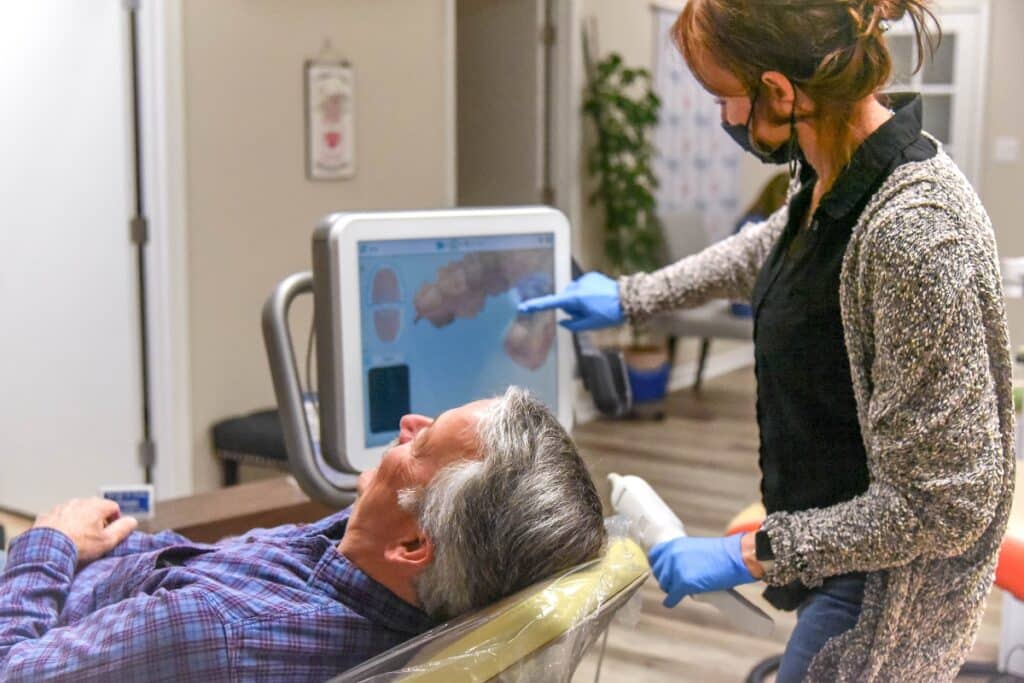 App-ortho-new-action-shot-28 Dr with patient older man